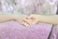 Couples holding hands in heart shape at pink flower park with t Royalty Free Stock Photo