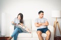 Couples just married, quarrel, refuse to talk to each other. Both sit on the sofa Royalty Free Stock Photo