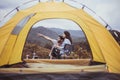 Couple lover looking something at outside tent feeling happy and smiling,Enjoying camping Royalty Free Stock Photo