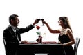 Couples lovers drinking wine dinner silhouettes