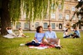 Couples of multi ethnic students are preparing for test, sitting Royalty Free Stock Photo