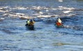 Couples paddling canoes Royalty Free Stock Photo