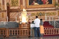 Couples praying in front of Our lady of health statue in Velankanni church, Also fondly known as `Lourdes of the East