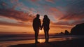 A couples silhouettes against a breathtaking sunset holding hands and enjoying the peacefulness of a Valentines Day Royalty Free Stock Photo