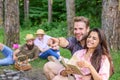 Couples spend time outdoors on sunny day. Youth on picnic or hike relaxing and having fun. Pleasant weekend. Couples Royalty Free Stock Photo