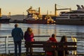 Couples in the sunset looking boats at the Beagle Channel. Ushuaia, Argentina