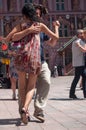 Couples of tango dancers on main place with other dancers at the spring tango festival