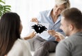 Psychotherapist Testing Spouses Showing Inkblot Picture Sitting In Office