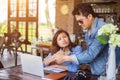 Couples using laptops to work together.