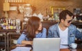 Couples using laptops to work together.