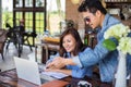 Couples using laptops to work together.