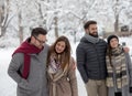 Couples walking in park on snow Royalty Free Stock Photo