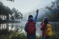 Couples who love to travel, take pictures Beatiful nature at Pang ung lake and pine forest at Mae Hong Son in Thailand Royalty Free Stock Photo