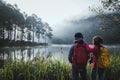 Couples who love to travel, take pictures Beatiful nature at Pang ung lake and pine forest at Mae Hong Son in Thailand Royalty Free Stock Photo