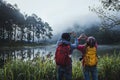 Couples Who Love To Travel, Take Pictures Beatiful Nature At Pang Ung Lake And Pine Forest At Mae Hong Son In Thailand