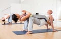 Couples yoga classes in modern fitness center