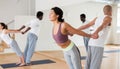 Couples yoga classes in modern fitness center