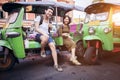 couples of young traveling people sitting on tuk tuk bangkok thailand Royalty Free Stock Photo