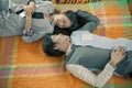 Couples of younger asian man and woman relaxing emotion lying in
