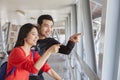 Couples of younger asian traveling man and woman looking Royalty Free Stock Photo