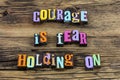 Courage is fear holding on believe challenge typography phrase