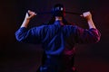 Close up shot, Kendo fighter wearing in an armor and traditional kimono is tying the lacing on his helmet standing back Royalty Free Stock Photo