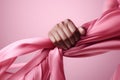 Courage in Pink Closeup of a womans hand holding