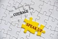 Courage to speak up text on missing jigsaw puzzle representing business culture in exercising speak up. Royalty Free Stock Photo