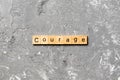 Courage word written on wood block. Courage text on cement table for your desing, concept Royalty Free Stock Photo