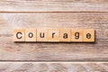 Courage word written on wood block. Courage text on wooden table for your desing, concept Royalty Free Stock Photo