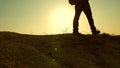 A courageous man-traveler, climbing to the top of a mountain, walking along a path along a dangerous rocky ridge. Steep Royalty Free Stock Photo