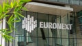 Sign and logo at the entrance to the Euronext building in the Paris La Defense business district