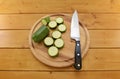 Courgette sliced with a knife on a chopping board Royalty Free Stock Photo