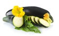 Courgettes cut into slices with flower and leaf on white Royalty Free Stock Photo