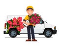 Courier boy with flowers bouquet, delivery truck Royalty Free Stock Photo