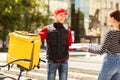 Courier Delivering Order To Customer Giving Pizzas Boxes Outdoors