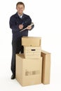 Courier Delivering Parcels Holding Clipboard