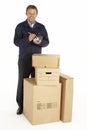 Courier Delivering Parcels Holding Clipboard