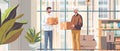 Courier delivers cardboard box parcel to a man in stylish modern office area. Delivery Man gives parcel to business Royalty Free Stock Photo