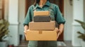 A courier delivers a stack of parcels to your front door, a professional home delivery service Royalty Free Stock Photo