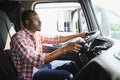 Courier Delivery. Black Man Driver Driving Delivery Car. Royalty Free Stock Photo