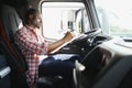 Courier Delivery. Black Man Driver Driving Delivery Car. Royalty Free Stock Photo