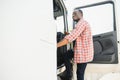 Courier Delivery. Black Man Driver Driving Delivery Car Royalty Free Stock Photo