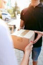 Courier Delivery Service. Closeup Hands Receiving Package Royalty Free Stock Photo