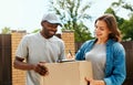 Courier Delivery Service. Man Delivering Package To Woman