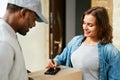 Courier Delivery Service. Man Delivering Package To Woman Royalty Free Stock Photo