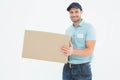 Courier man carrying cardboard box Royalty Free Stock Photo