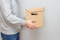 Courier with a parcel in his hands. Delivery concept. Cardboard box Royalty Free Stock Photo