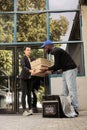 Courier passing customer pizza boxes stack Royalty Free Stock Photo