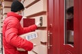 Courier deliver parcels in brown cardboard boxes to the door